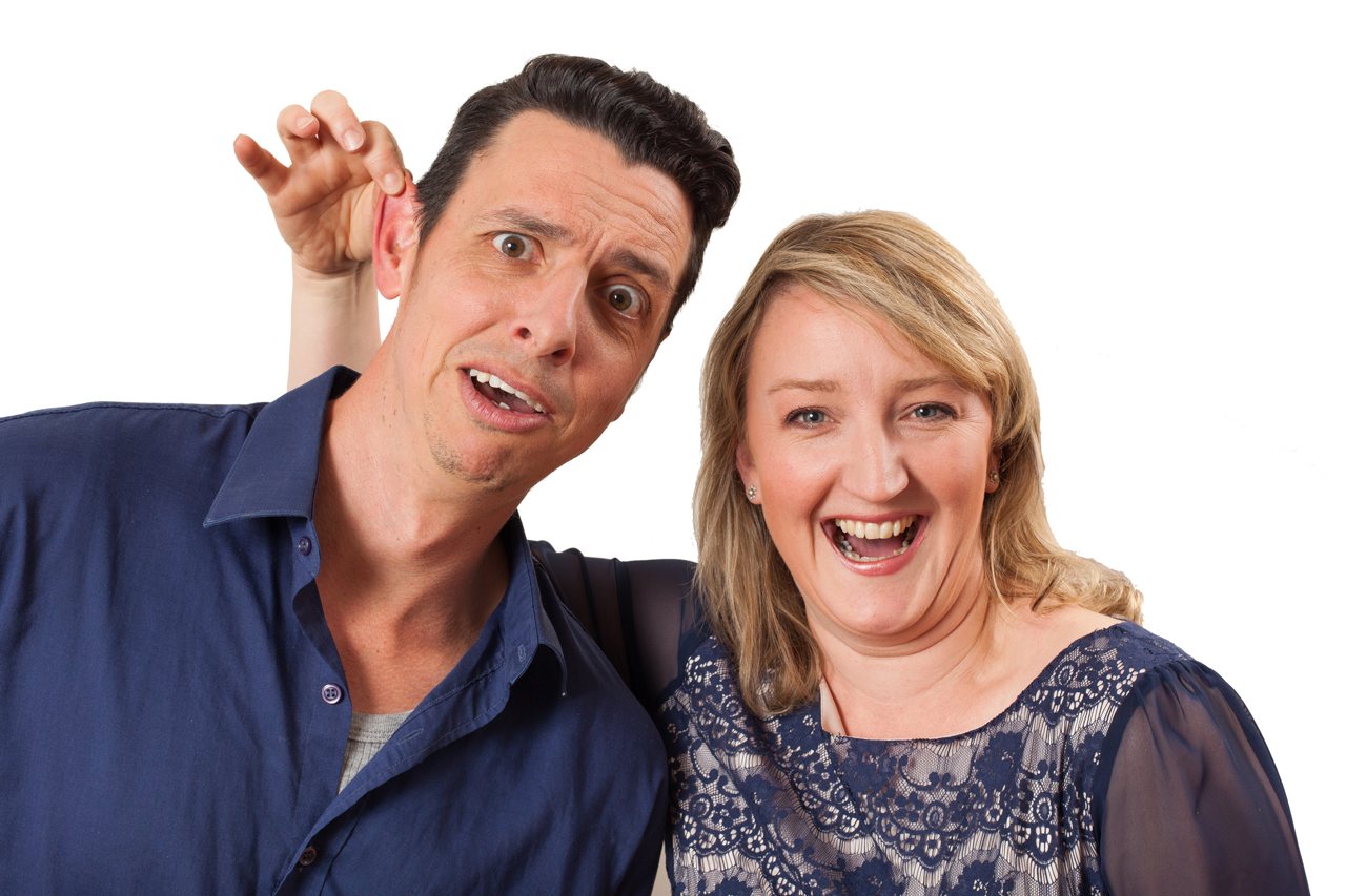 Sarah Kinsella holds fellow IM performer Rik Brown by the ear and laughs